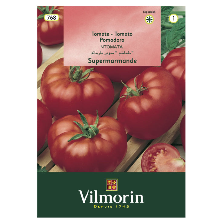 En esta imagen aparece un sobre de semillas de tomate marca Vilmorin.  En el envase aparece una foto con varios tomates grandes.